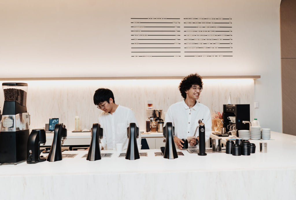 Coffee Program Manager, Calvin Tang with barista, Thalez Bortotti