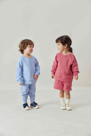 a boy and a gril wearing norsu organic Organic french terry sweatshirt