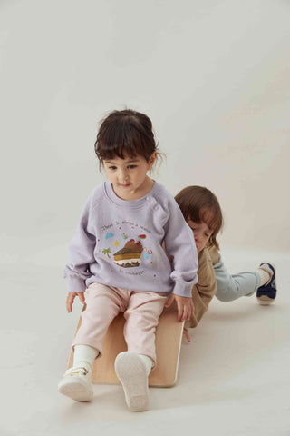 a girl and a boy wearing norsu organic french terry collection playing 