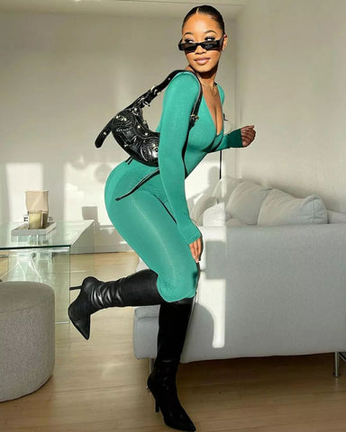 model wearing amelia dark green seamless jumpsuit from Missy Empire