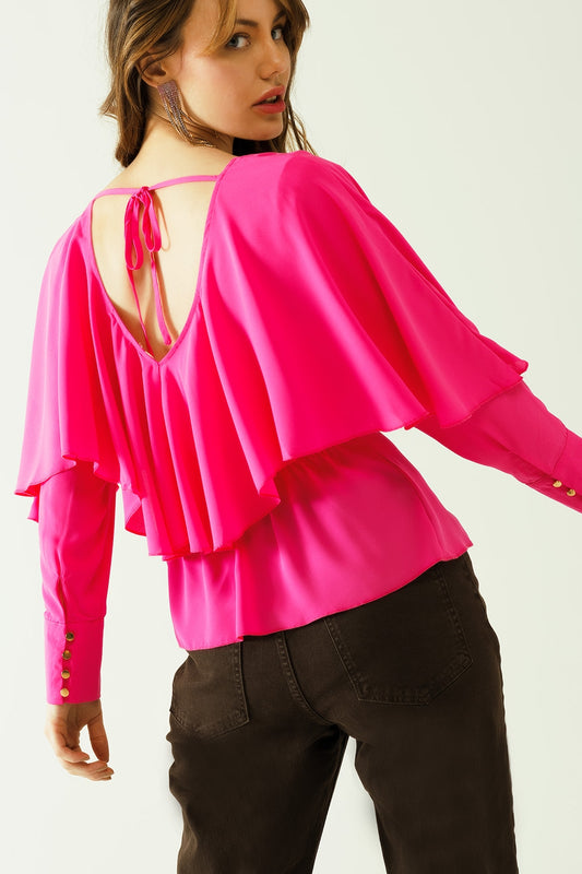 Top fucsia con volante, cuello de pico, puños abotonados y detalle de lazo en la espalda