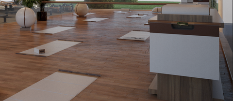 White yoga mats made of Italian calf leather spread on the floor.