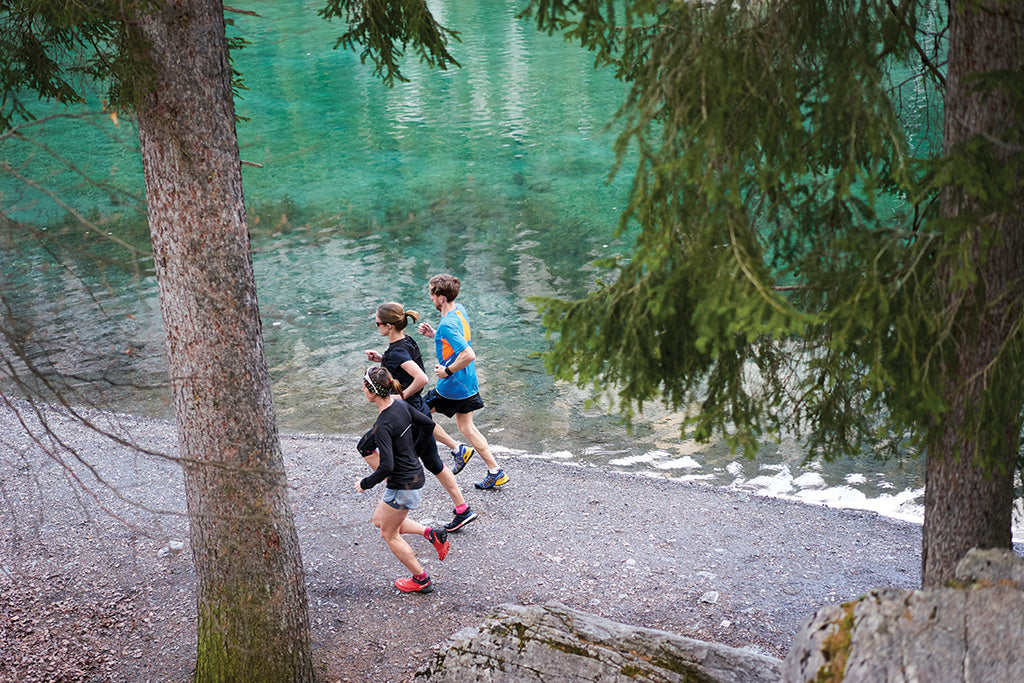 Always be aware that a photographer may be hiding in the bushes, so make sure you're looking your best when running next to beautiful mountain lakes © Tim Lloyd