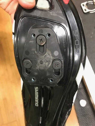 Bottom of a shimano cycling shoe with wear from a speedplay cleat
