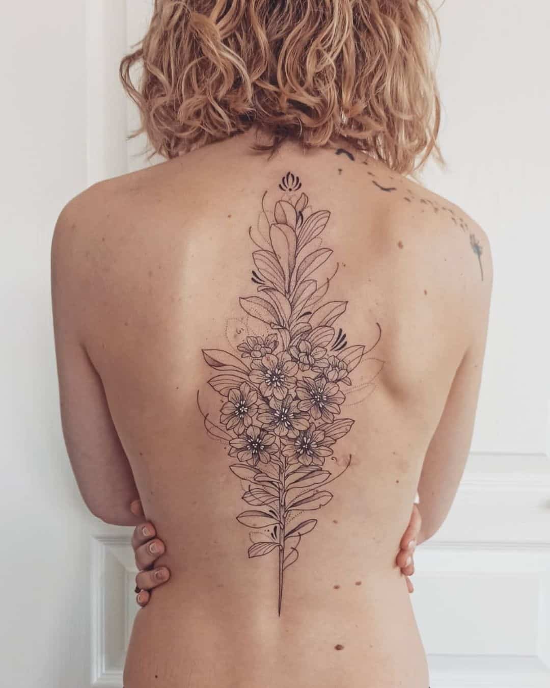 spine tattoo  Spine tattoos for women Tattoos for women Leg tattoos women