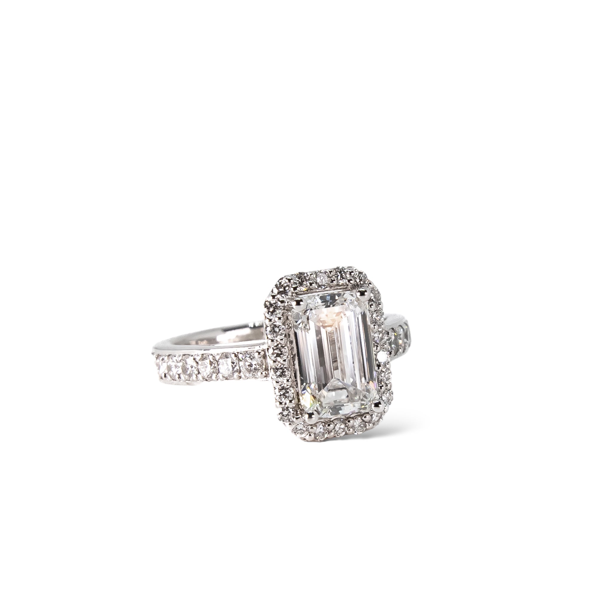 Emerald cut engagement ring with a diamond halo
