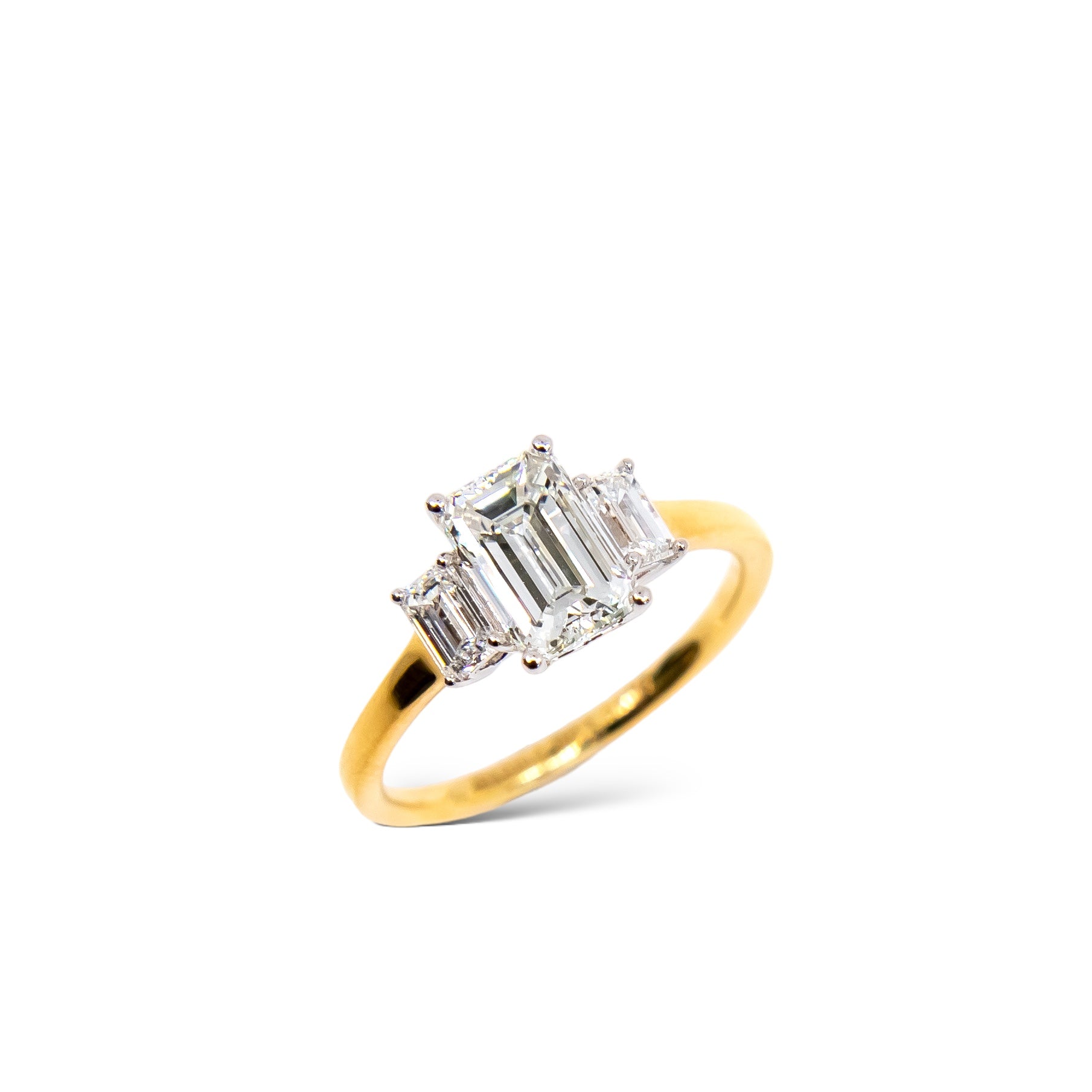 Emerald cut engagement ring with emerald cut diamond side stones