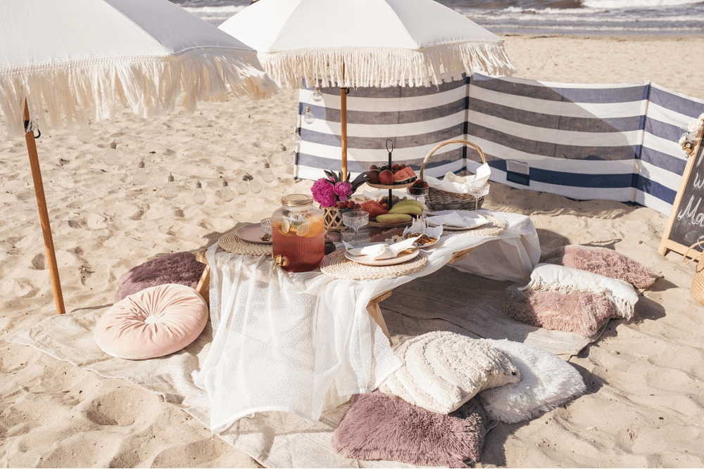 bohemian table setup on the sand