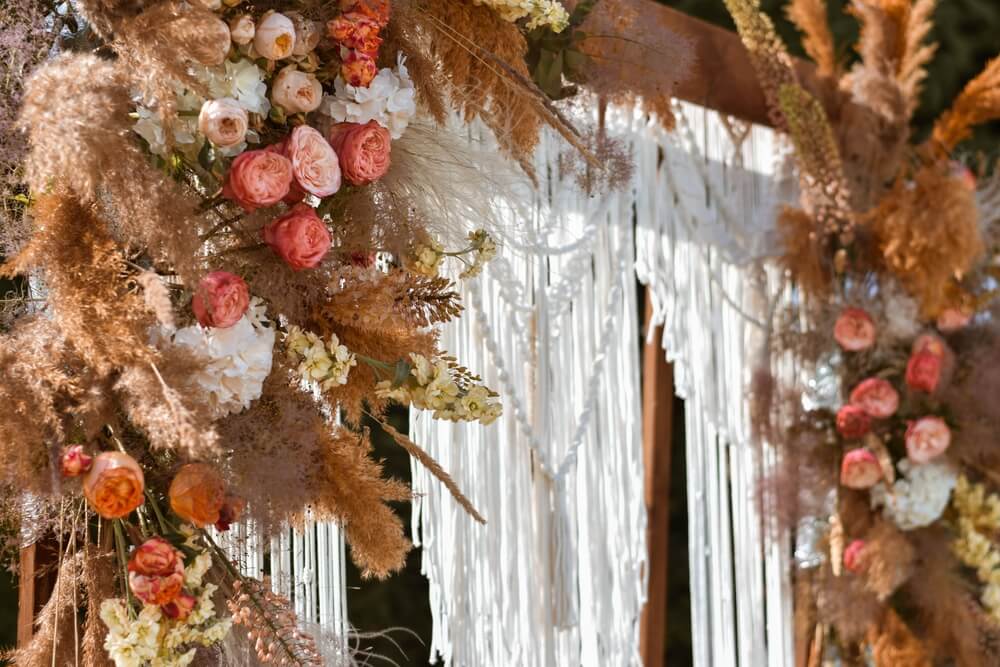 boho chic wedding arch with macrame decor