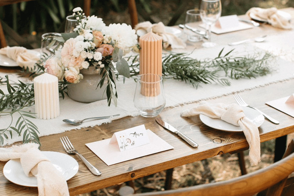wedding table decorated with rustic elements and candles