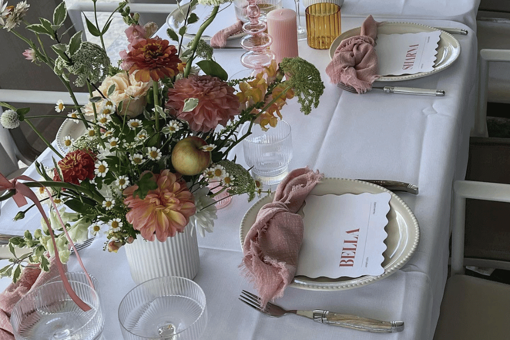 wedding table decorated with rustic table decorations in blush pink shades