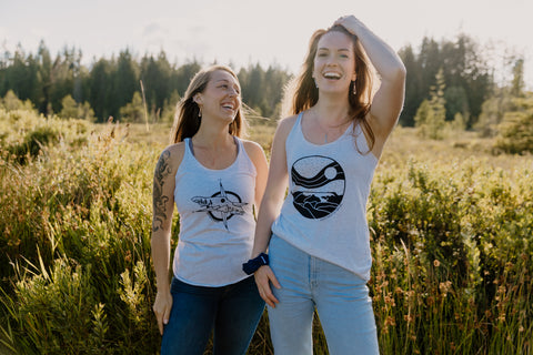 two models happy in field wearing Indra water drop earrings and Necklace