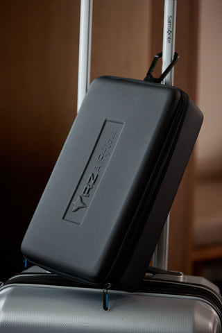 Image of the RZ Airflow Travel Case clipped to a suitcase, ready for travel
