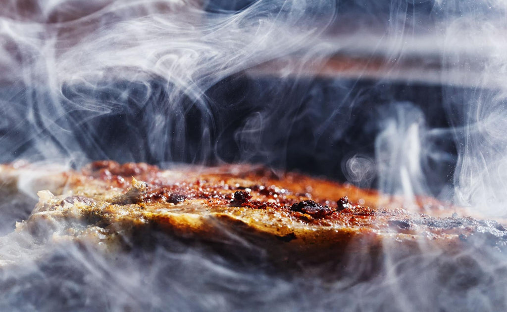 An up-close image of a piece of smoking meat.