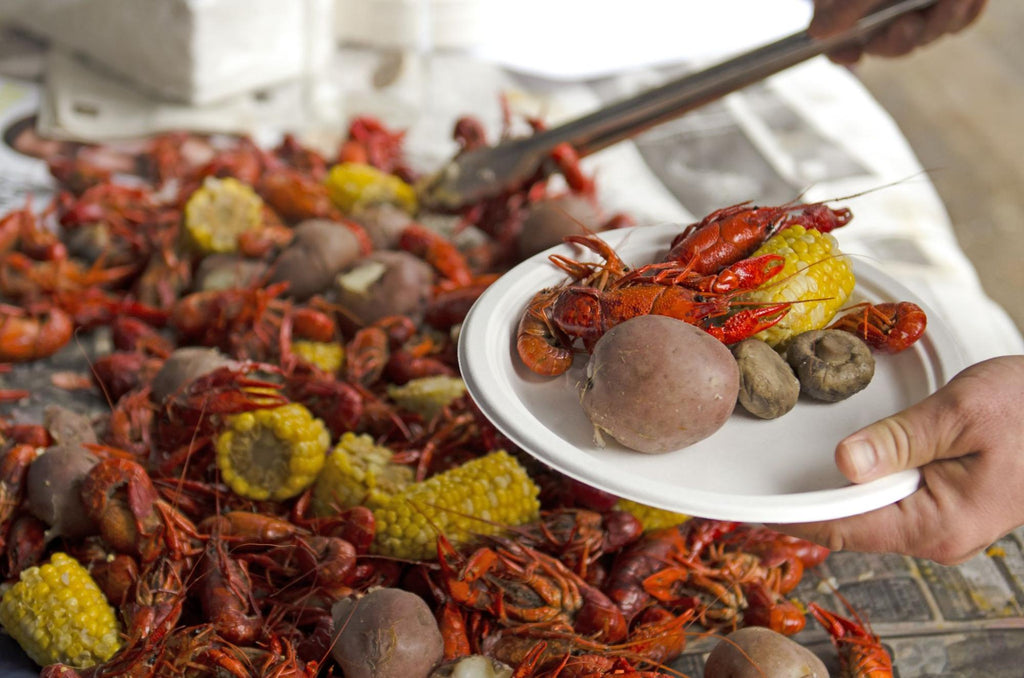 A crawfish boil with corn and potatoes