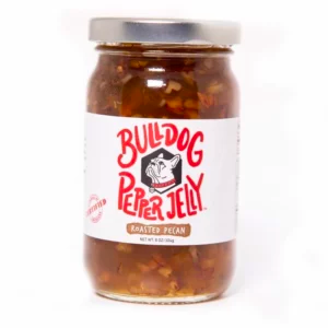 A glass jar of fig pepper jelly available for purchase online
