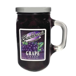 A glass jar of grape jelly for purchase.