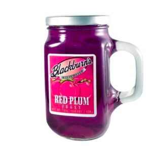 A glass jar of red plum jelly.