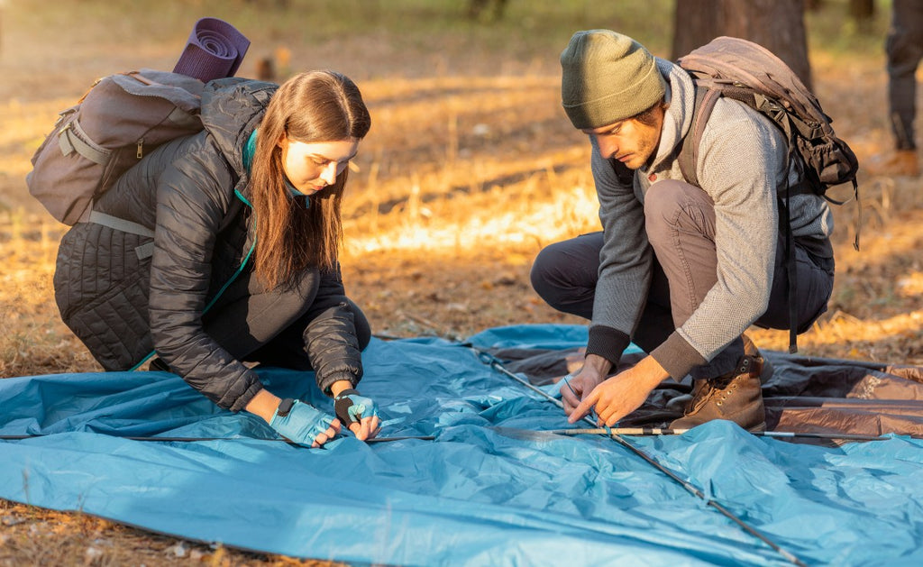 Couple pitch tent