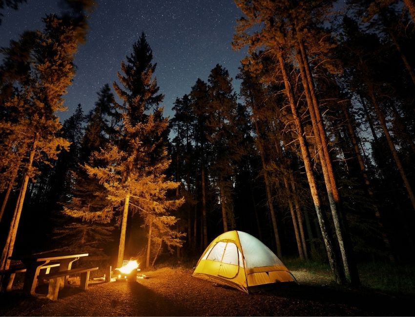 cozy tent at night with light on