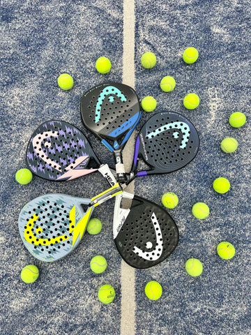 Padel racquets with padel-tennis balls on the court
