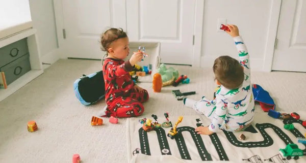 kids playing with toys on the floor