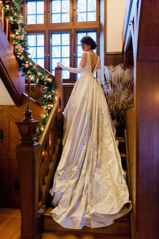 bride on Willowdale's staircase in historic mansion Boston, MA