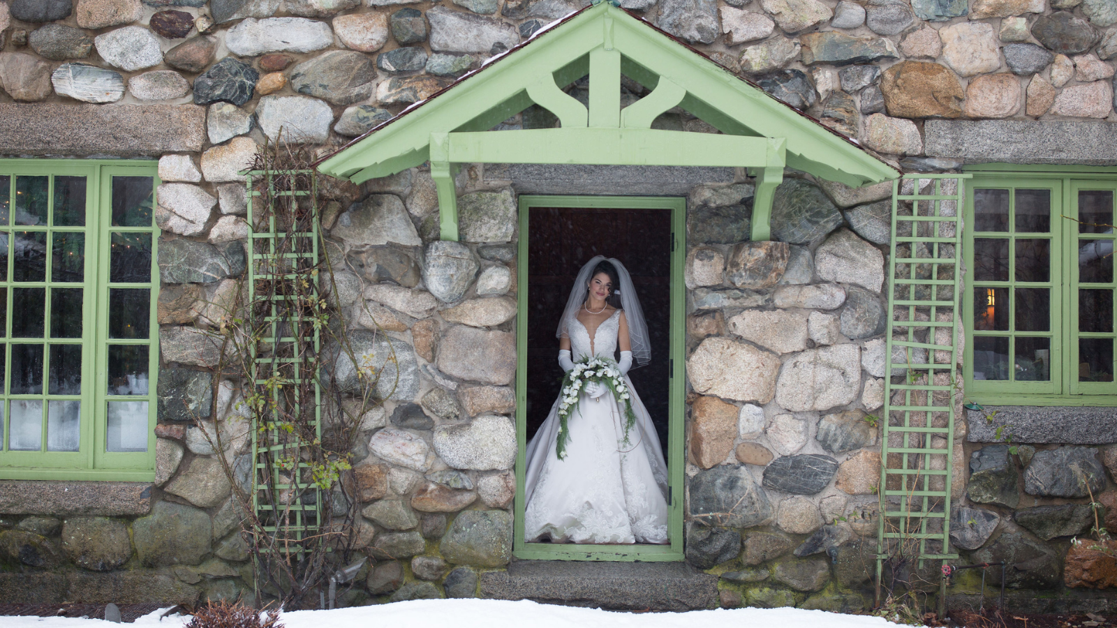 winter bride in green doorway at Willowdale Estate, Topsfield Massachusetts