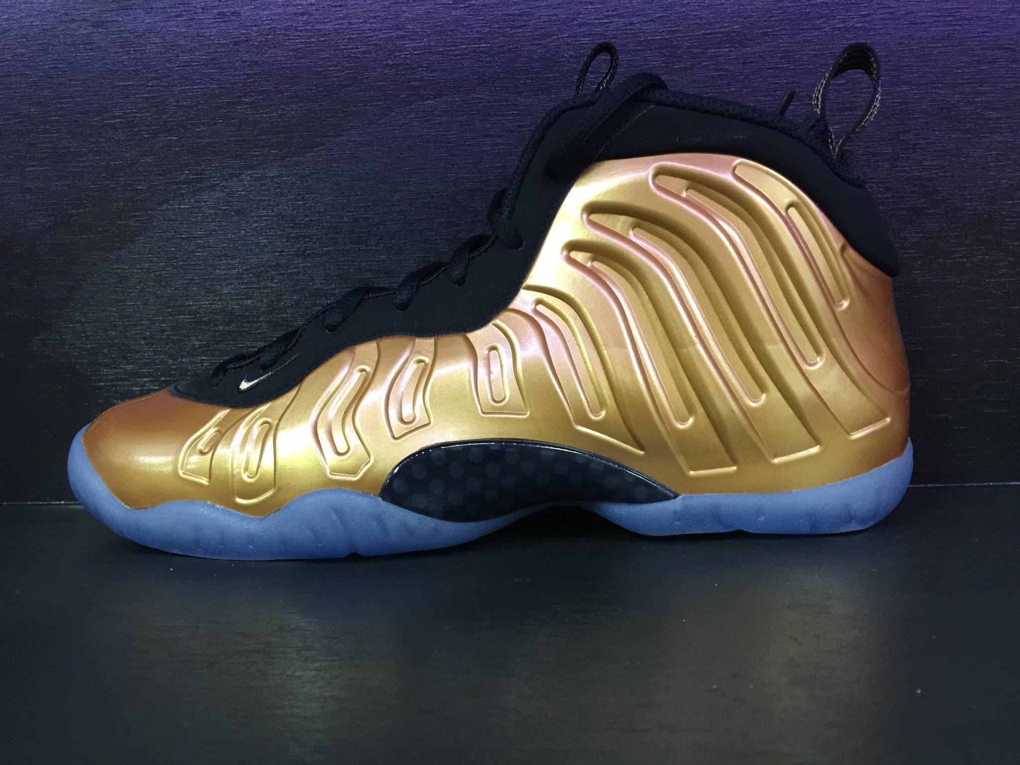 gold nike foamposite grade school