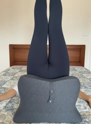 Woman comfortably supported by Intimacy Pillow