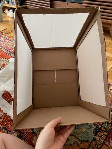 inside of box with tissue paper taped to the outside