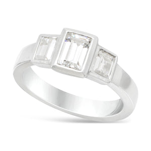 trilogy ring with emerald cut diamonds