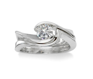 0.5ct diamond and platinum engagement ring with fitted wedding band