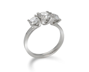 trilogy engagement ring diamond and platinum claw setting