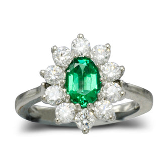 A Traditional emerald and diamond cluster ring