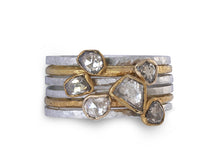 Stacking rings in silver and gold set with rough diamonds