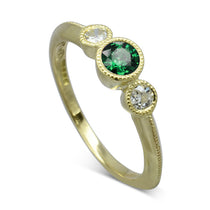 vintage trilogy engagement ring with emerald