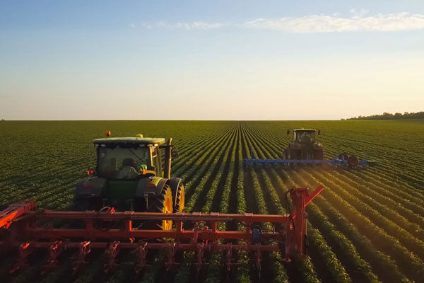 conventional agriculture field with tractors