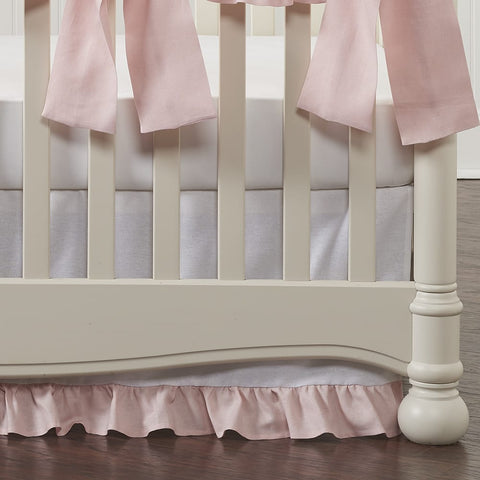 white crib skirt with petal pink linen ruffle