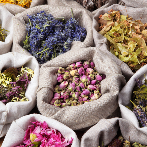 lots of herbs in bags like dandelion hibiscus rosemary lavender