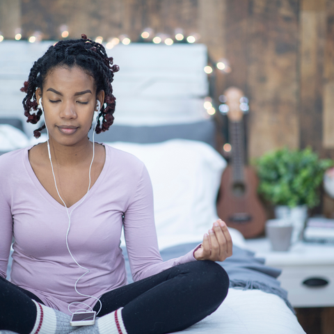 woman meditating to cope with hair loss