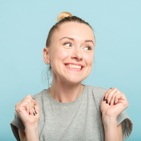 excited woman on blue background