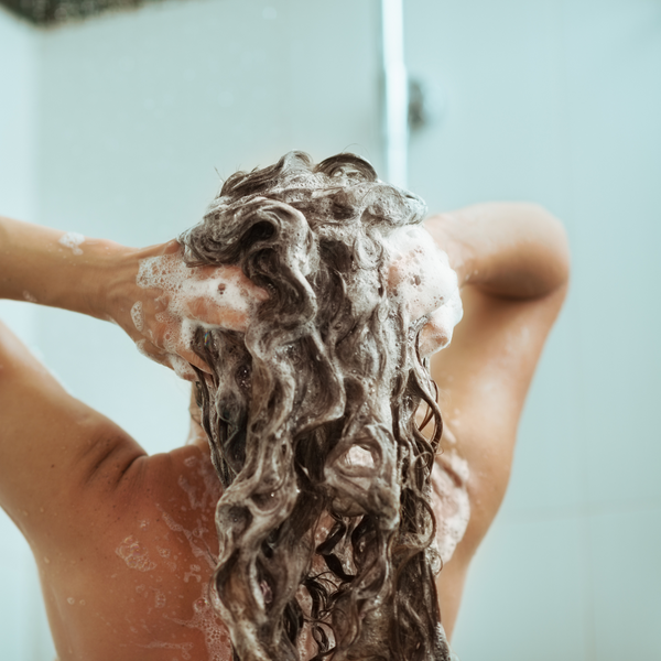 woman washing hair in the shower