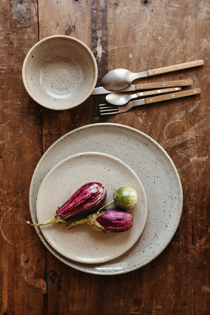 purple eggplant on a stoneware plate