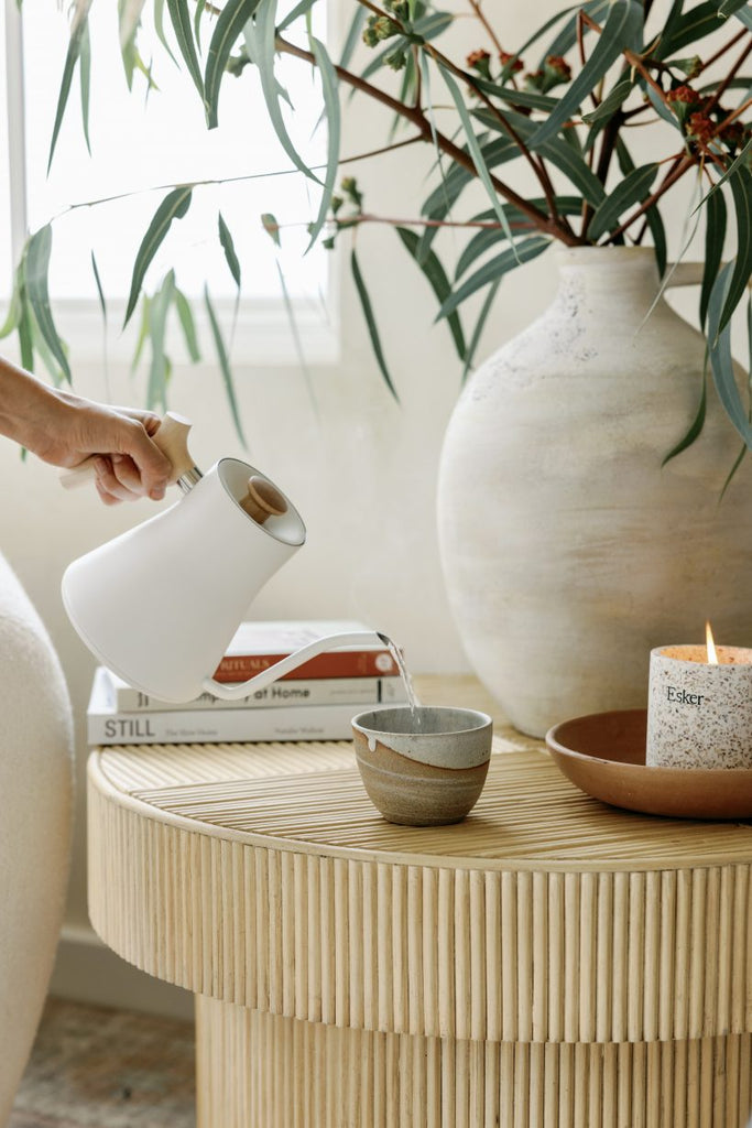 tea pouring into the ritual mug