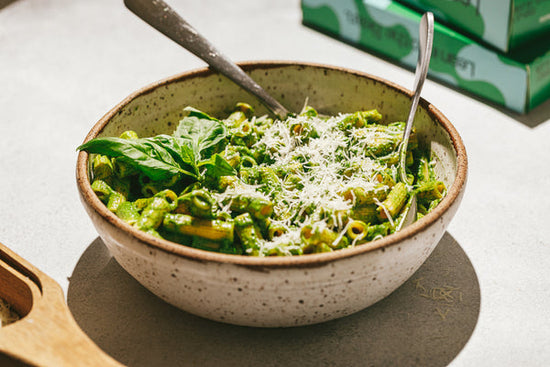 Green pasta sauce served over lupini pasta with fresh basil and Parmesan.