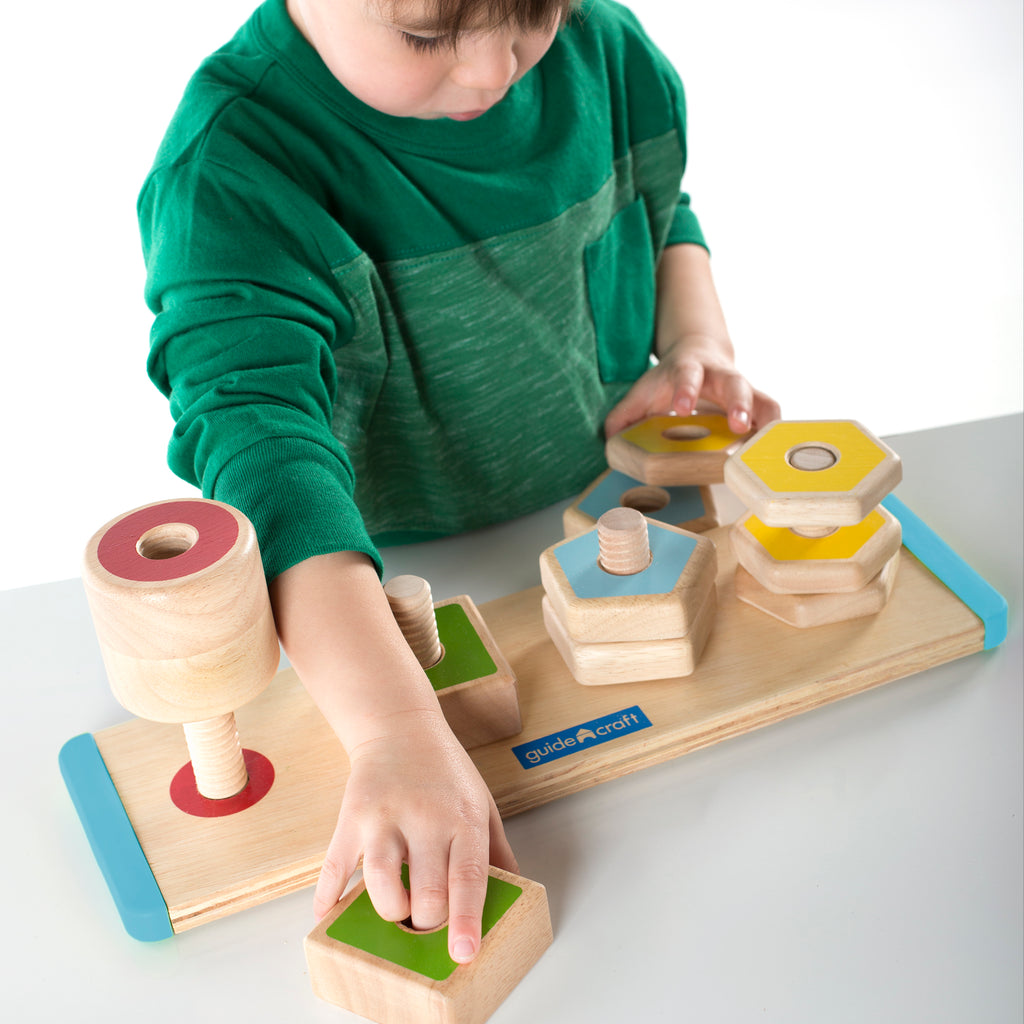 Boy playing with Early Learning Skill Builder Puzzle