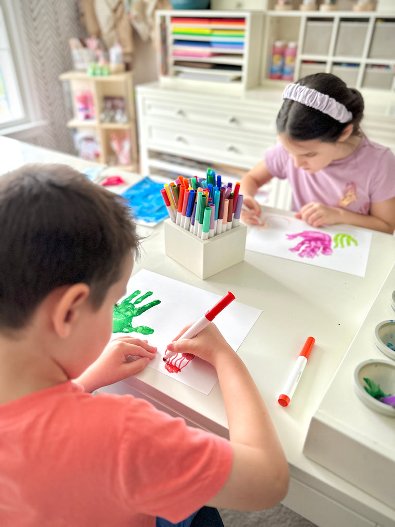 Use marker or crayon to draw a coral and seaweed