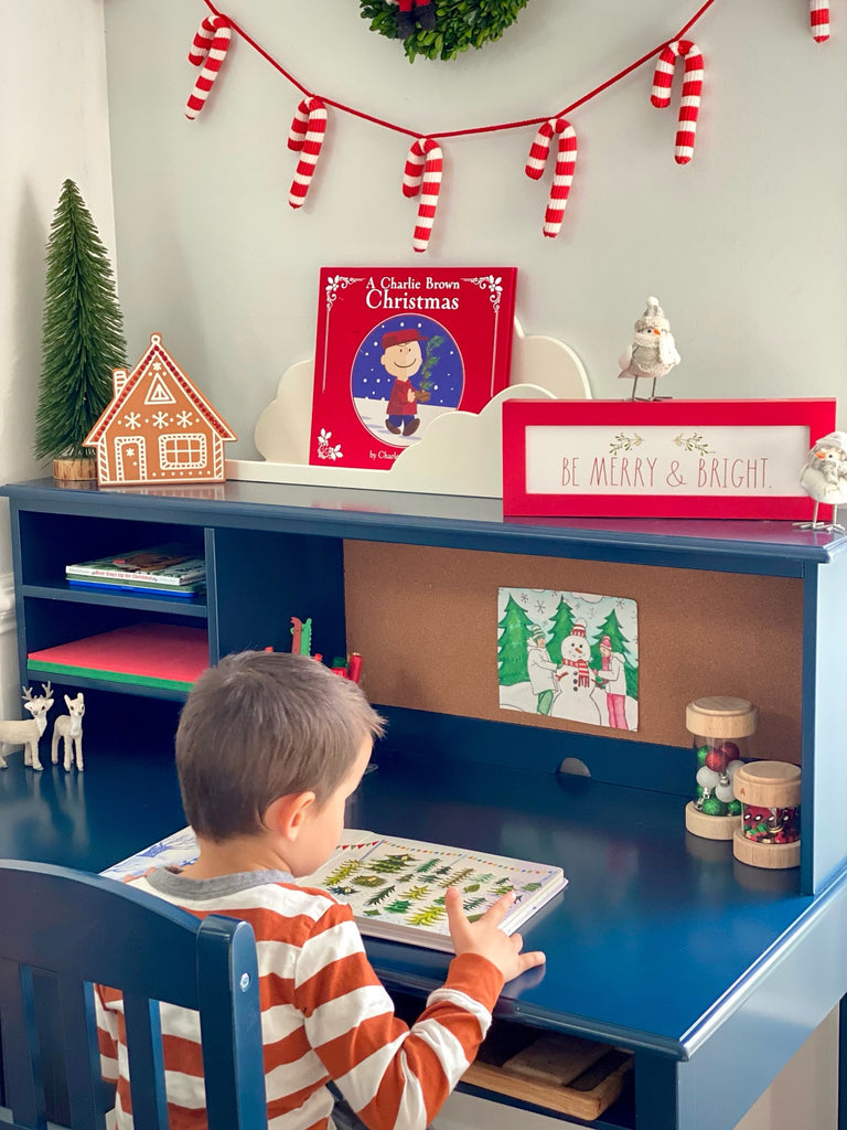 Boy sitting in chair, reading at Navy Taiga Desk