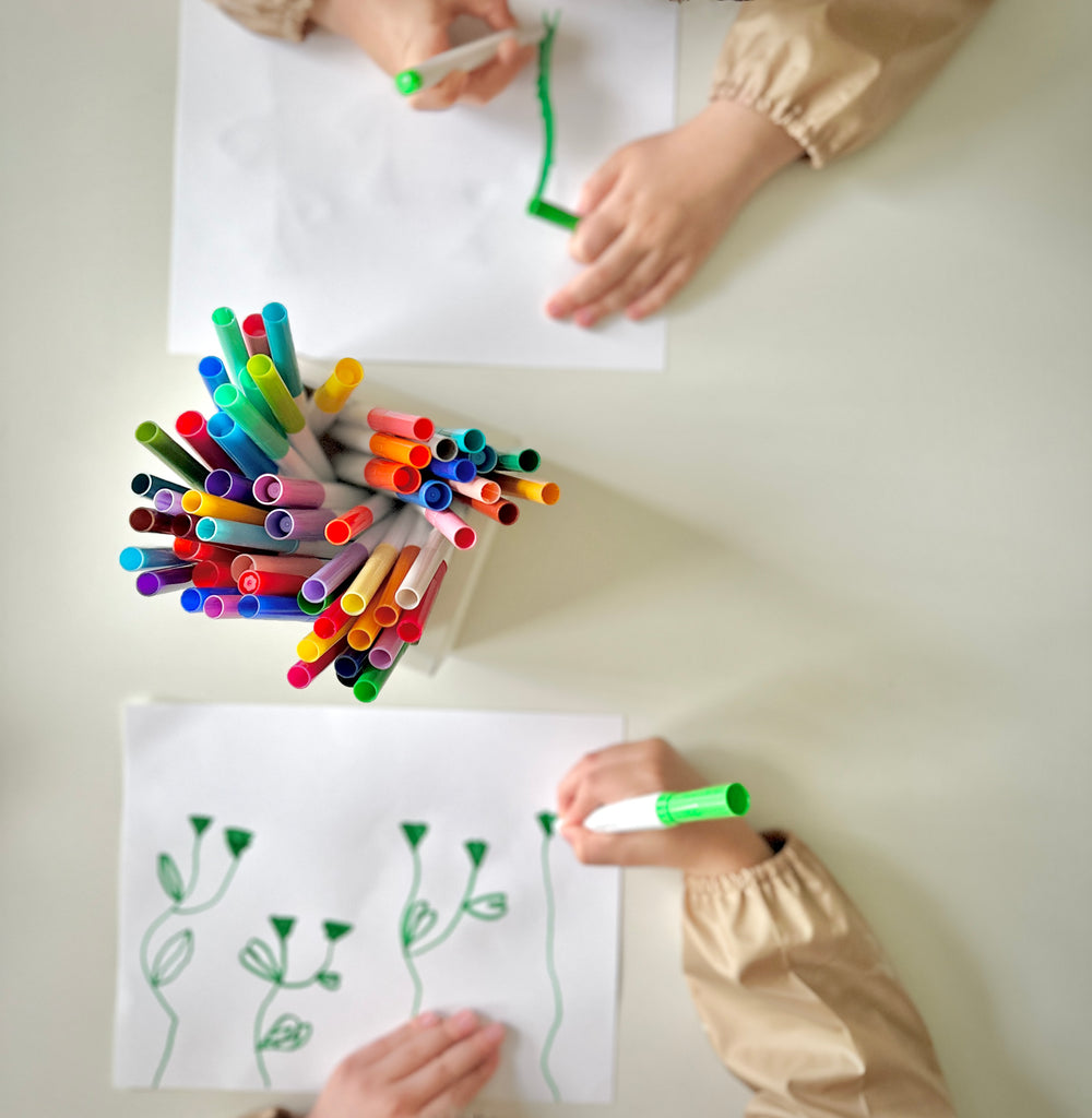 Kids drawing stems using marker from Martha Stewart Crafting Kids' Accessory Tray